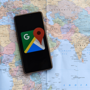 Google mobile app on top of map showing local business listings