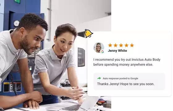 two auto body shop employees checking their customer reviews